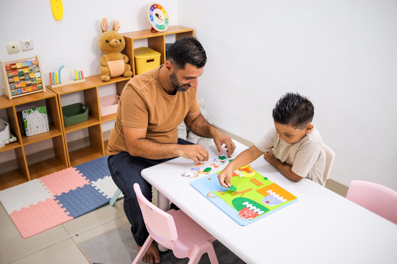 Father And Son Bonding While Playing With Puzzles
